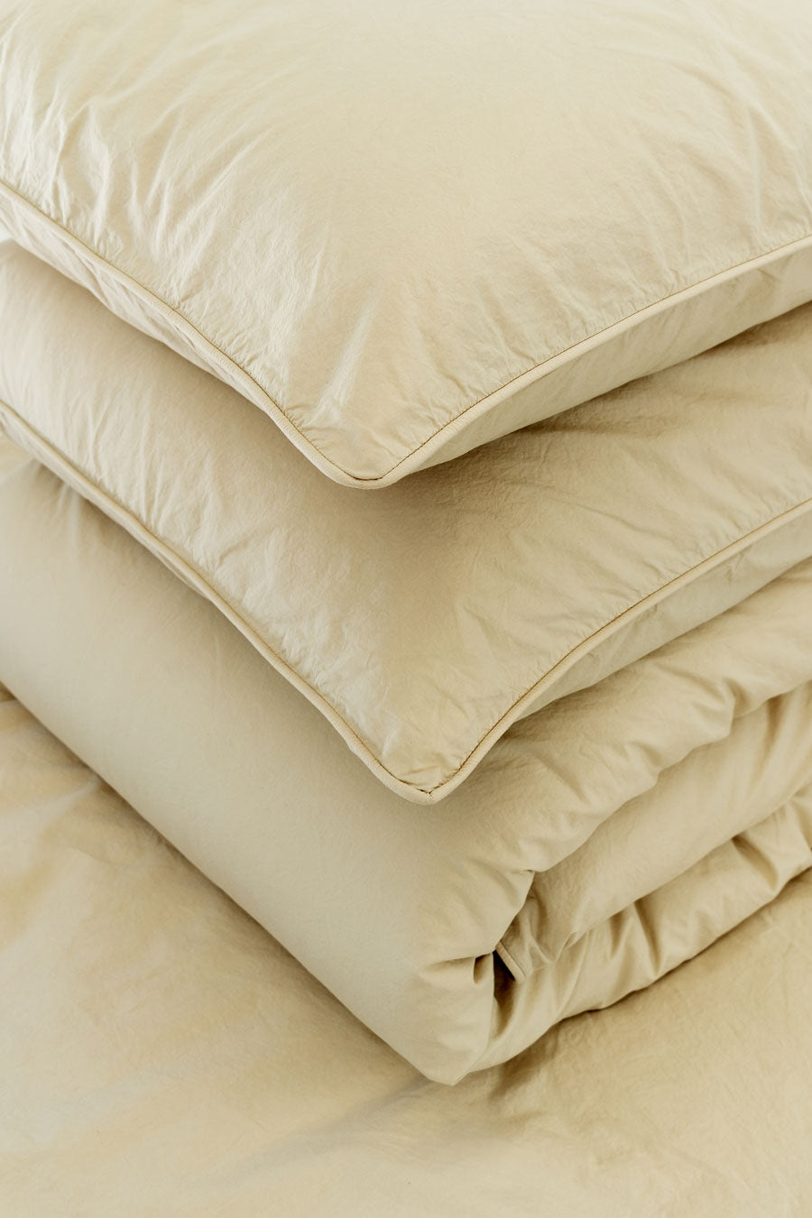 Organic Cotton Percale duvet cover set with a beige duvet cover and two beige pillowcases.