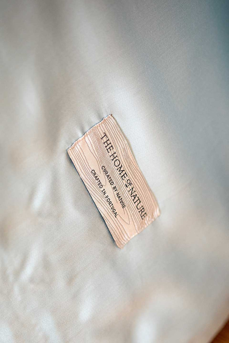 The Home of Nature label on a green TENCEL™ Lyocell Sateen duvet cover.