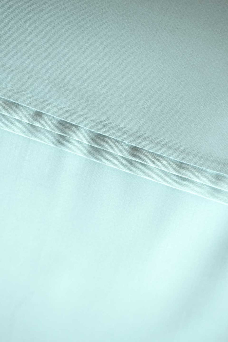 Detail of a serene mint pillowcase in TENCEL™ Lyocell from THON.
