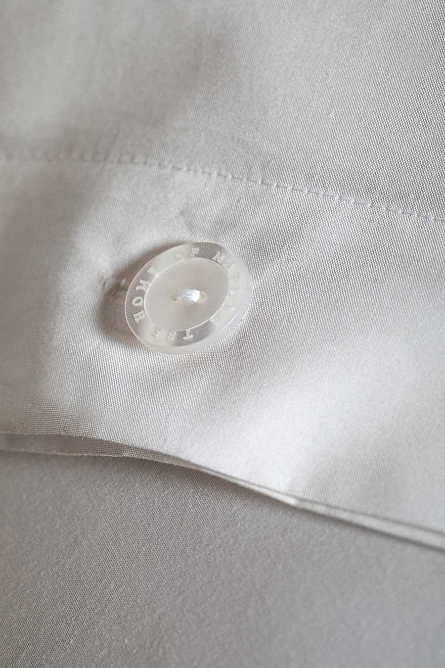 The Home of Nature button on an Egyptian Cotton™ Percale pillowcase.