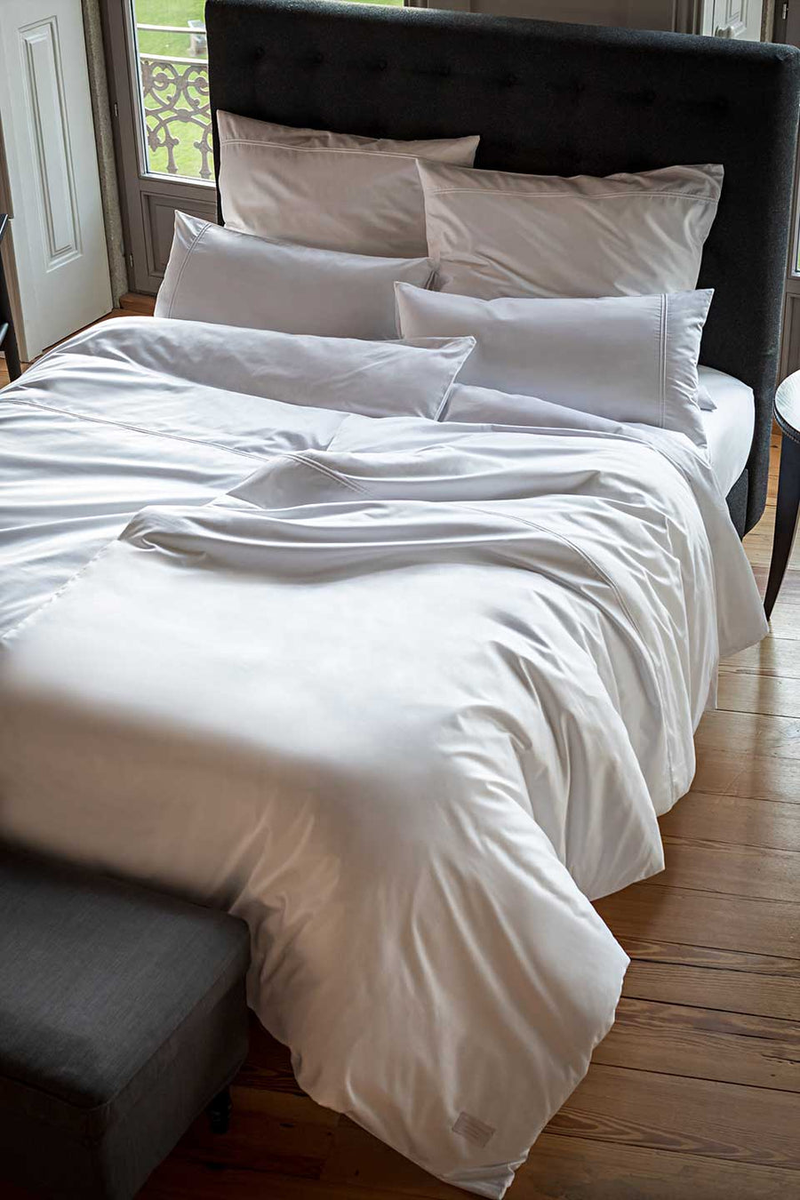 Bed with white Egyptian Cotton™ Sateen bedding.