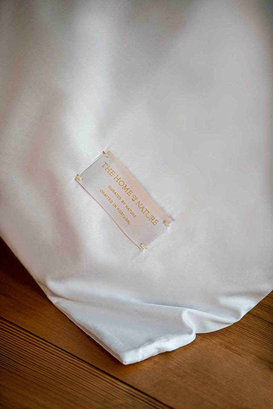 Label from The Nature Home on a white Egyptian Cotton™ Sateen duvet cover.