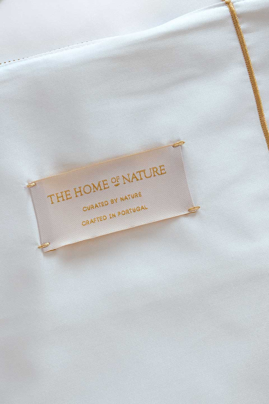 Label from The Nature Home on a white Egyptian Cotton™ Sateen eco-friendly packaging.