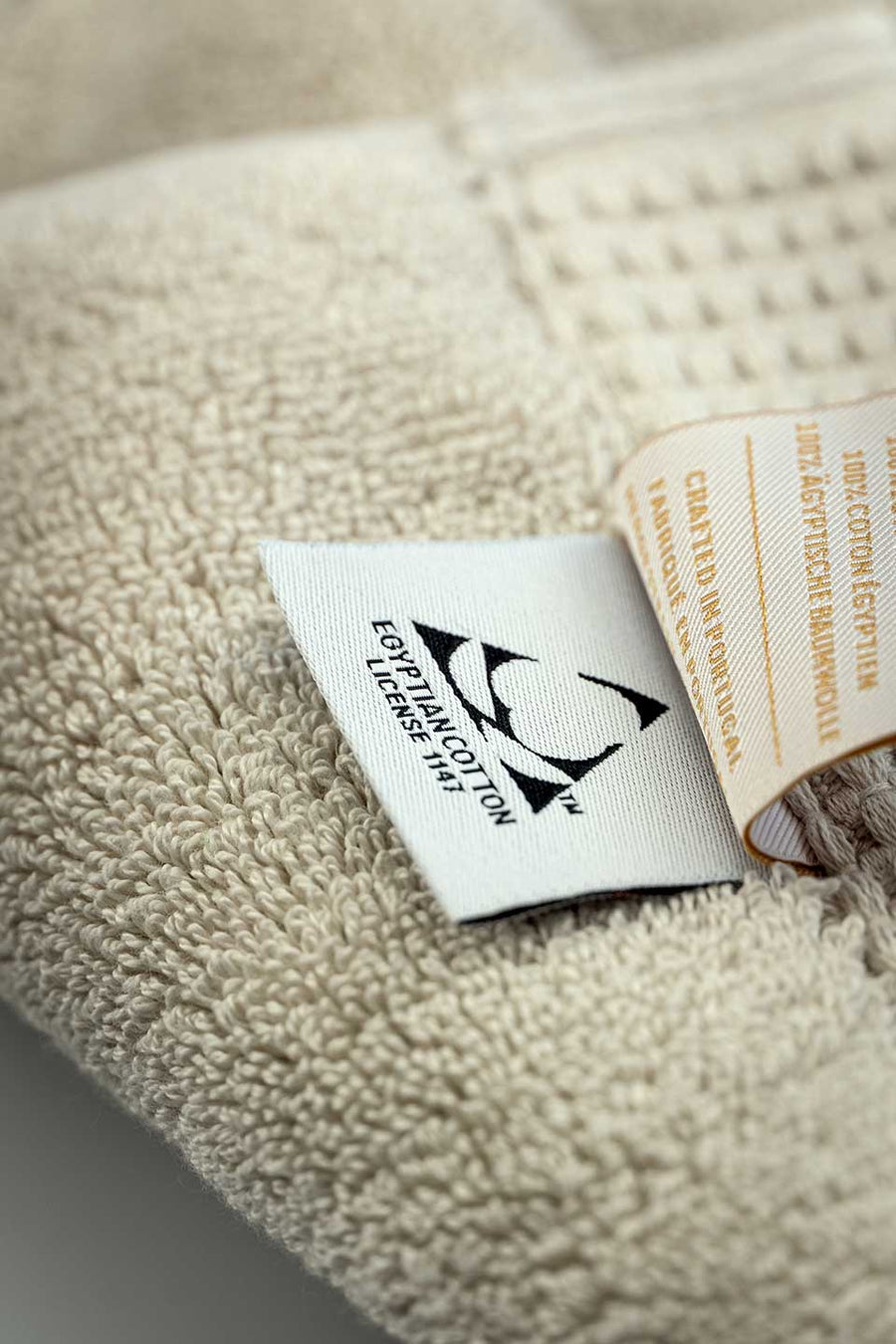 Egyptian Cotton™ seal on a beige Egyptian Cotton™ Bath Mat.